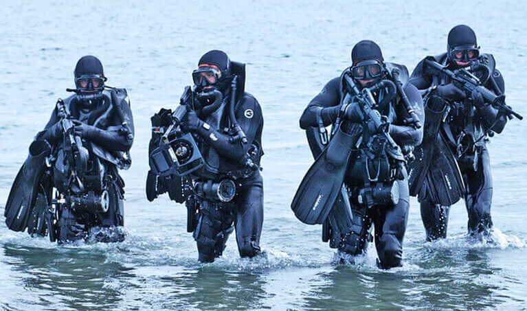 Navy Seals walking out of the ocean
