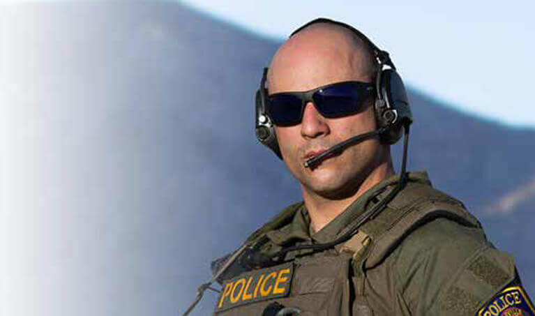 Law enforcement officer wearing ballistic-rated eyewear
