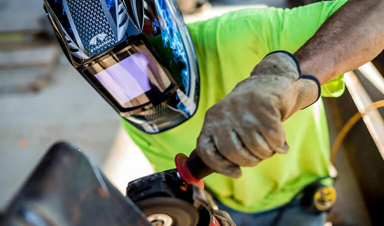 Welder wearing a Pyramex welding helmet