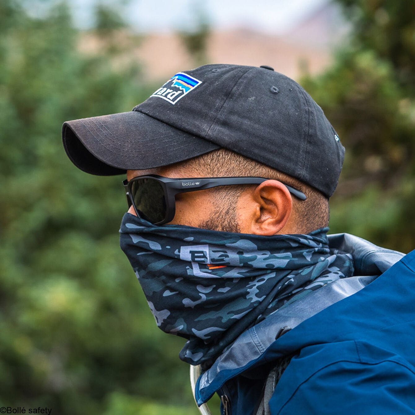 Bolle KNOXXT50M Knox Safety Glasses Black Frame with Polarized Smoke Anti-Fog Lenses worn with neck gator