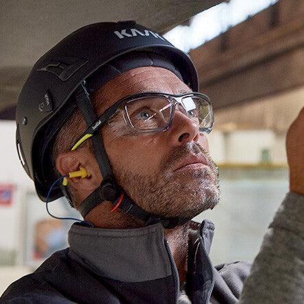 A worker wearing Bolle Safety Prescription Safety Glasses ordered through the Seamless Vision program