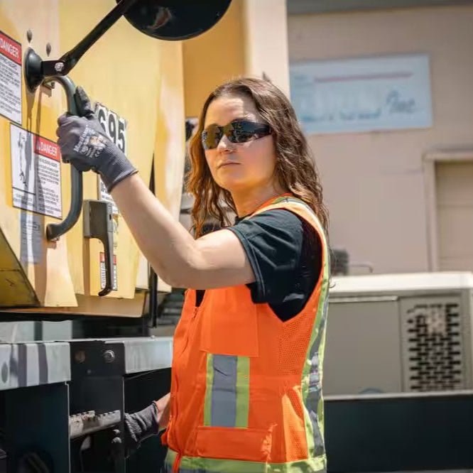 Bouton Eva Women's Safety Glasses with Pink Frame and Gray Lenses worn by worker outdoors