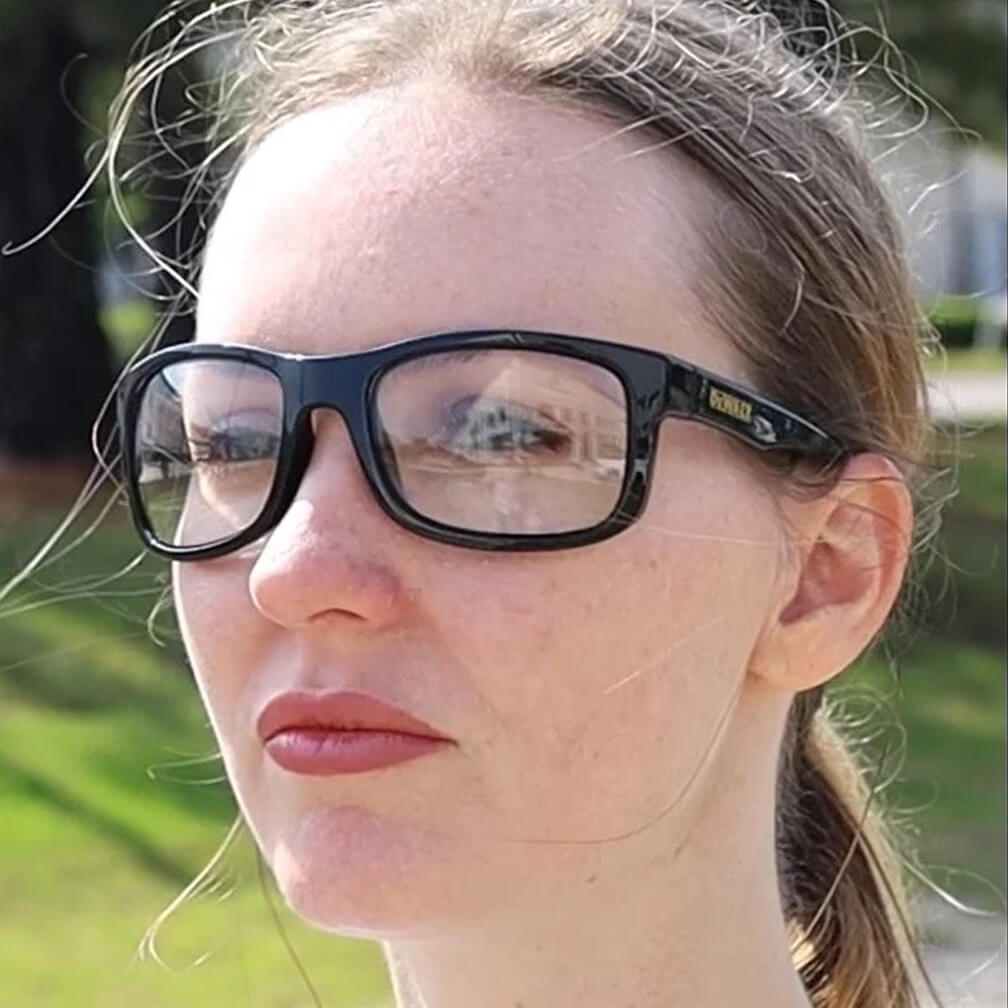 DEWALT DPG107-1D Supervisor Safety Glasses - Black Frame - Clear Lens worn by worker outdoors