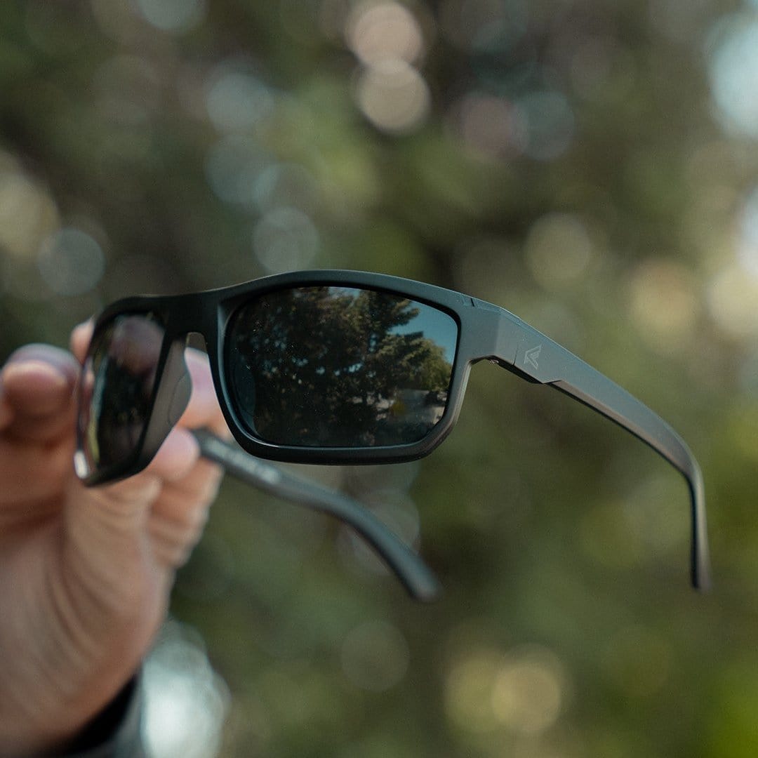 Edge Defiance Safety Glasses with Smoke Vapor Shield Lens held in the hand
