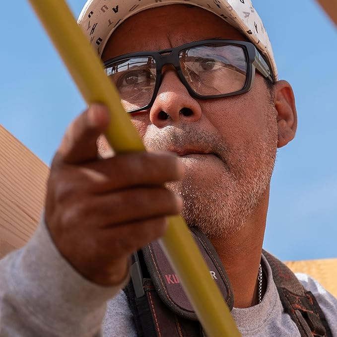 Edge Lassen Safety Glasses Black Frame with Clear Lenses worn by construction worker