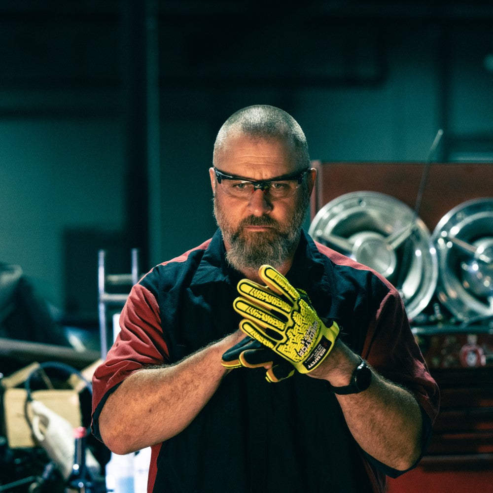 MCR Safety Dominator DM3 Safety Glasses Black Frame with Clear Lenses worn by mechanic