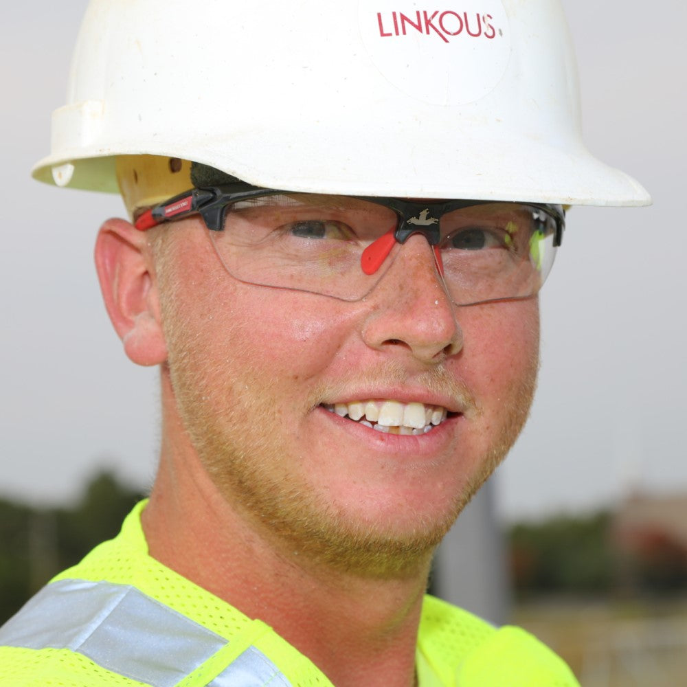 MCR Safety Dominator DM3 Safety Glasses Gunmetal Frame with Clear Lenses worn with hardhat