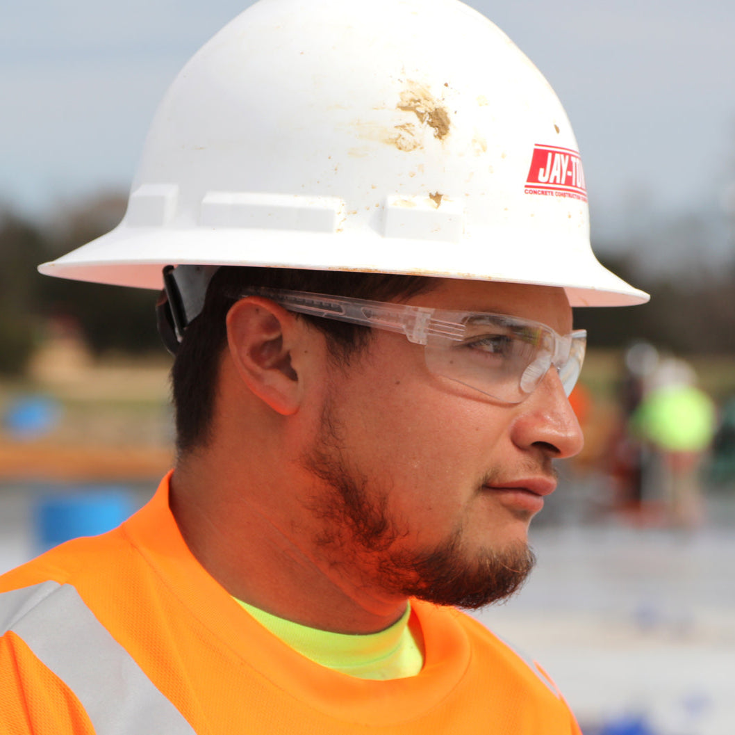 MCR Safety HK210PF HK2 Safety Glasses Clear MAX6 Anti-Fog Lenses worn by construction worker with hard hat