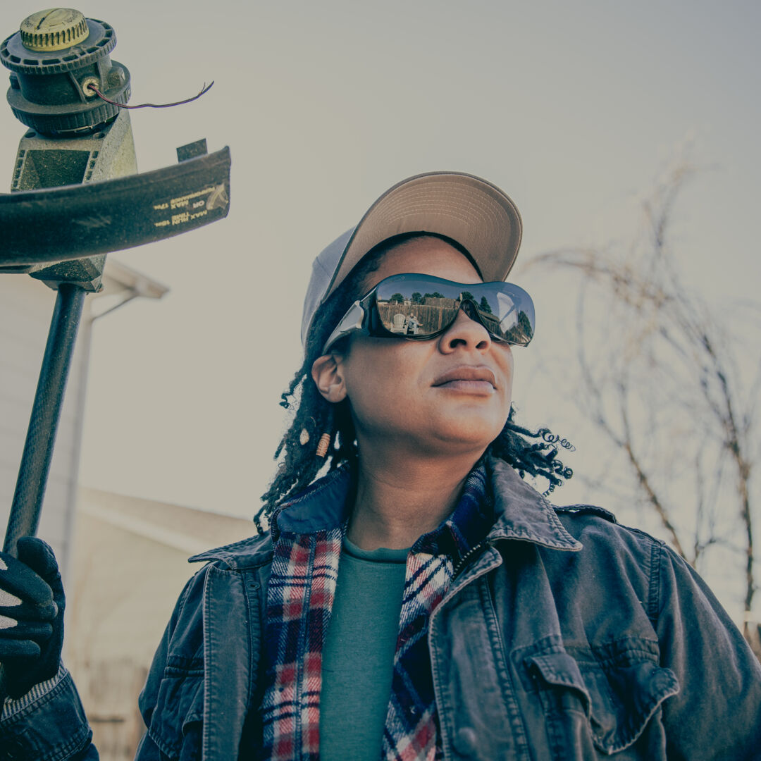 MCR Safety Law OTG Safety Glasses with Gray Anti-Fog Lenses worn by a yard maintenance worker