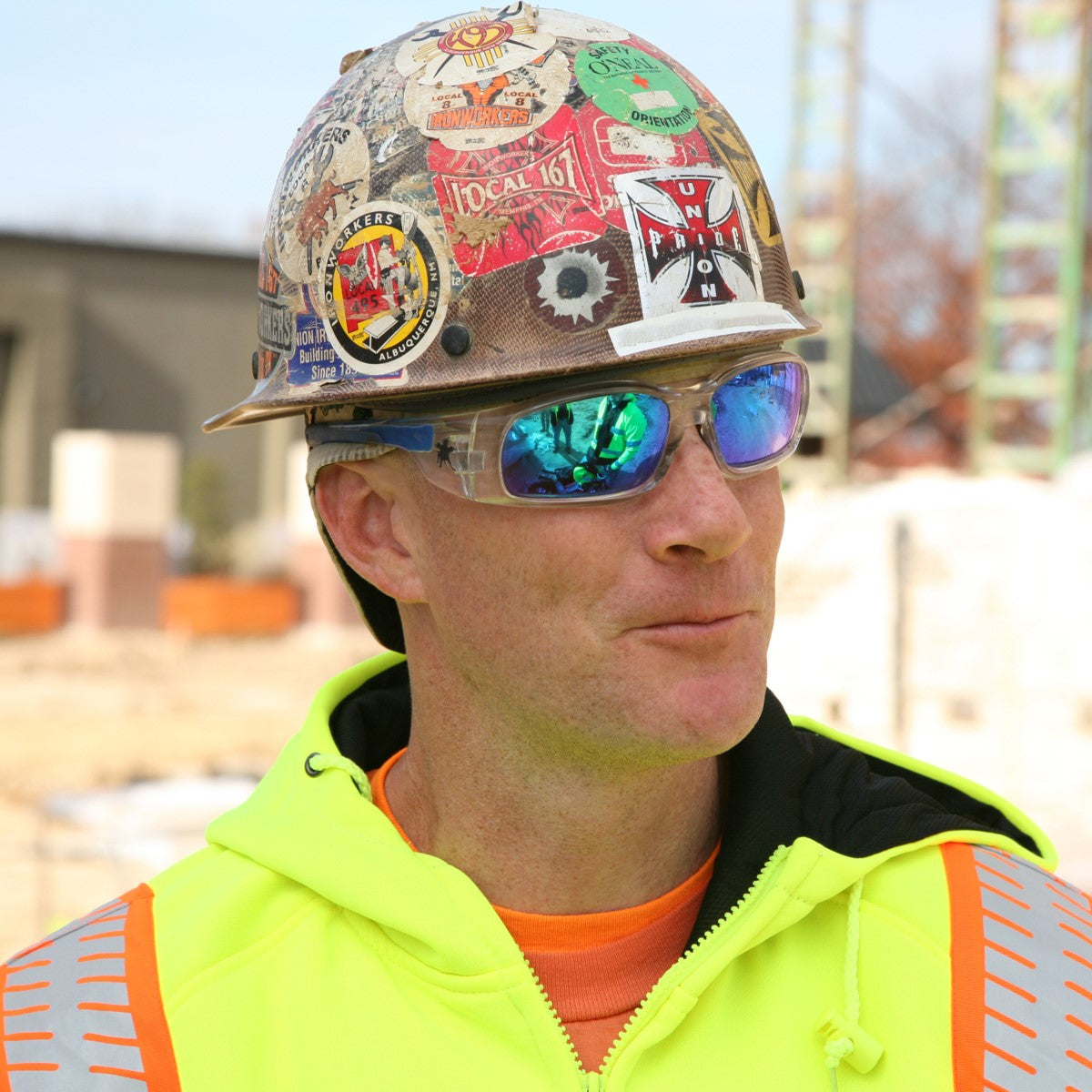 MCR Safety Swagger SR1 Safety Glasses Clear Frame with Blue Diamond Mirror Lenses worn by construction worker with hard hat SR148B