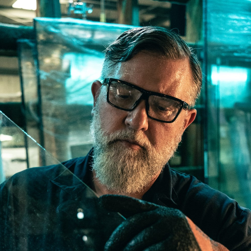 MCR Safety Swagger SR2 SR210AF Safety Glasses with Black Frame and Clear Lens worn by worker