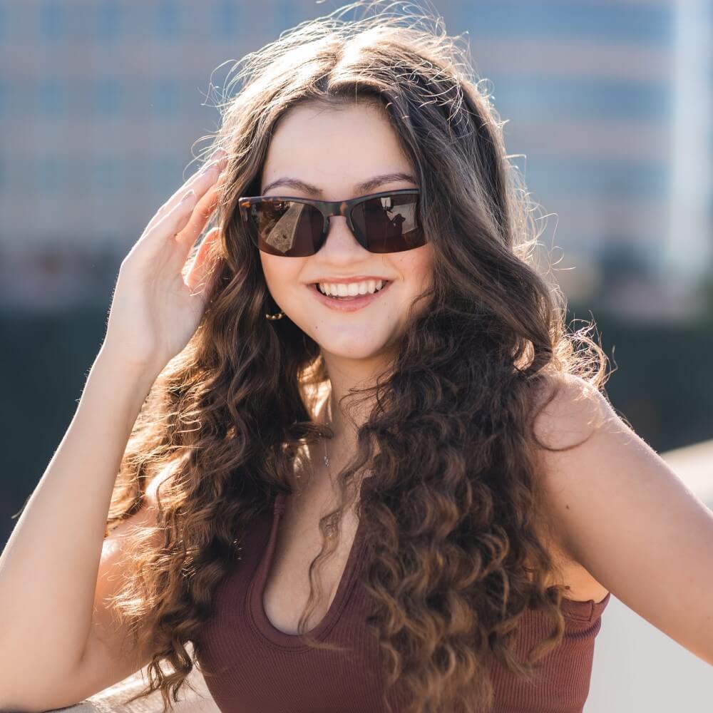 Woman wearing Epoch Eyewear Victor Sunglasses
