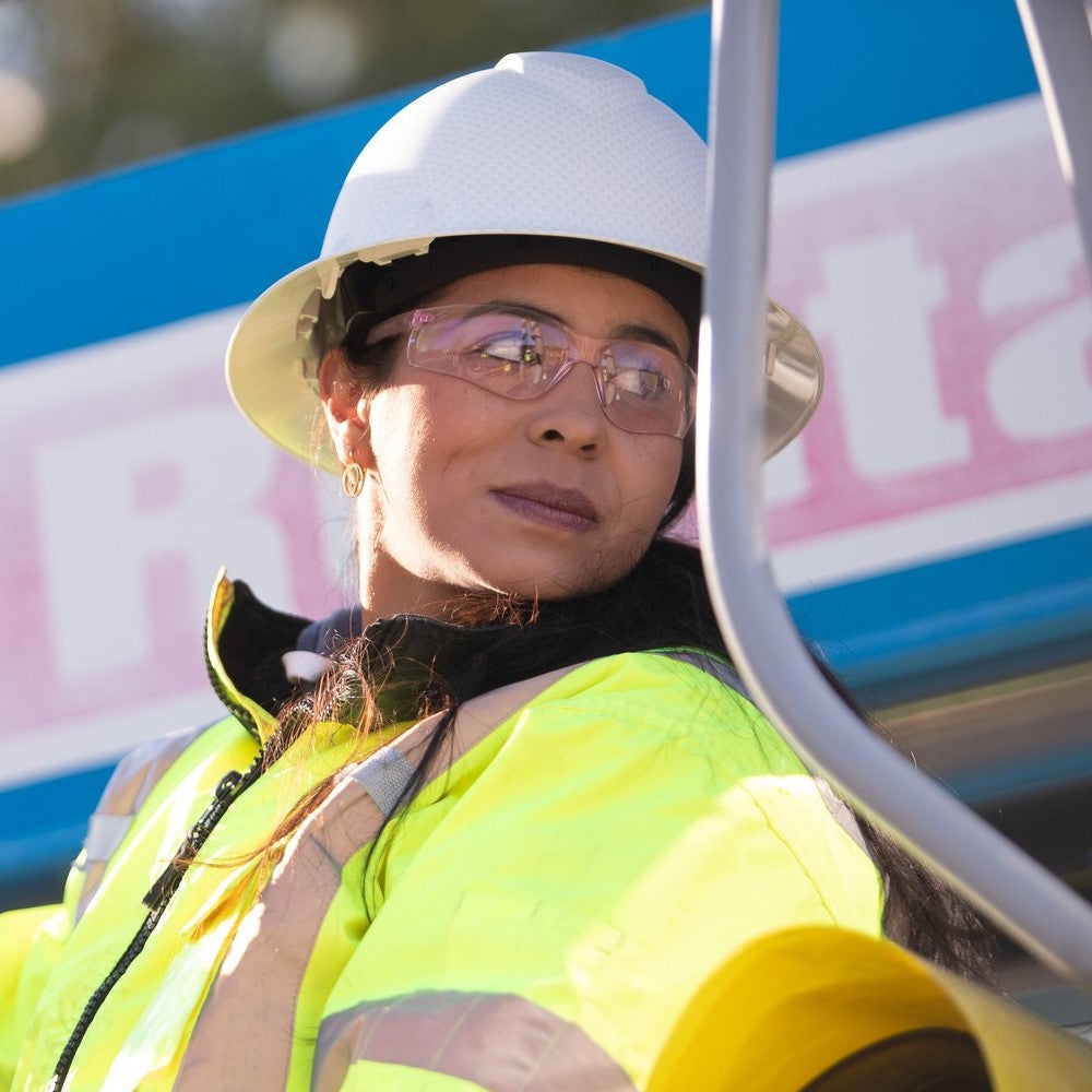 Pyramex S2517SN Safety Glasses worn by a woman driving a forklift