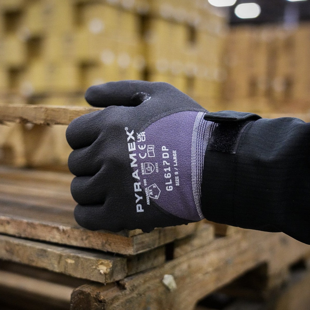 Pyramex GL617 Micro-Foam Nitrile Gloves worn while moving wood pallets