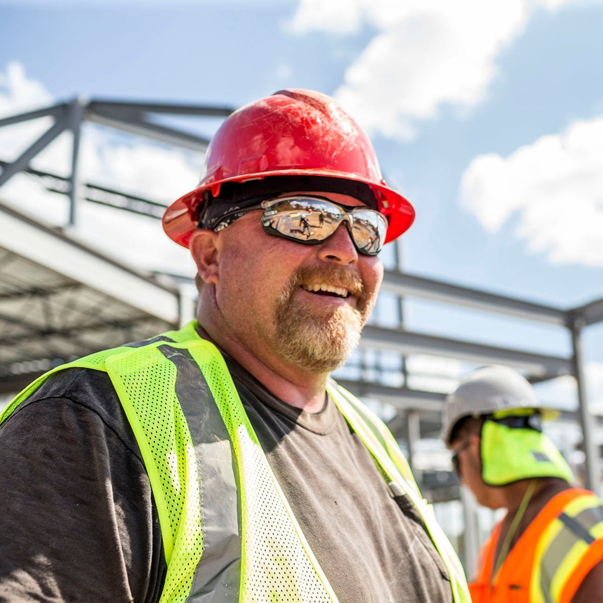 Pyramex HP54120 Ridgeline Full Brim Hard Hat - 4-Point Ratchet Suspension - Red worn by construction worker