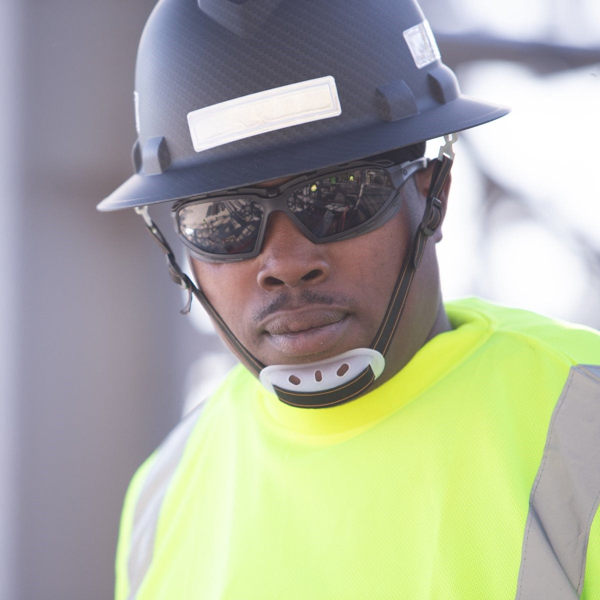 Pyramex Highlander Plus Safety Glasses Black Foam-Lined Frame Gray Anti-Fog Lens worn by worker
