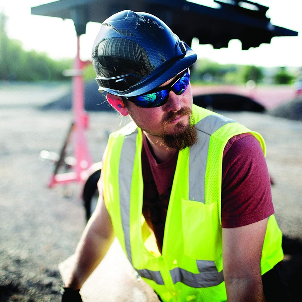 Pyramex Ridgeline Hydro Dipped Cap Style Hard Hat with 4-Point Ratchet Suspension worn on a construction site