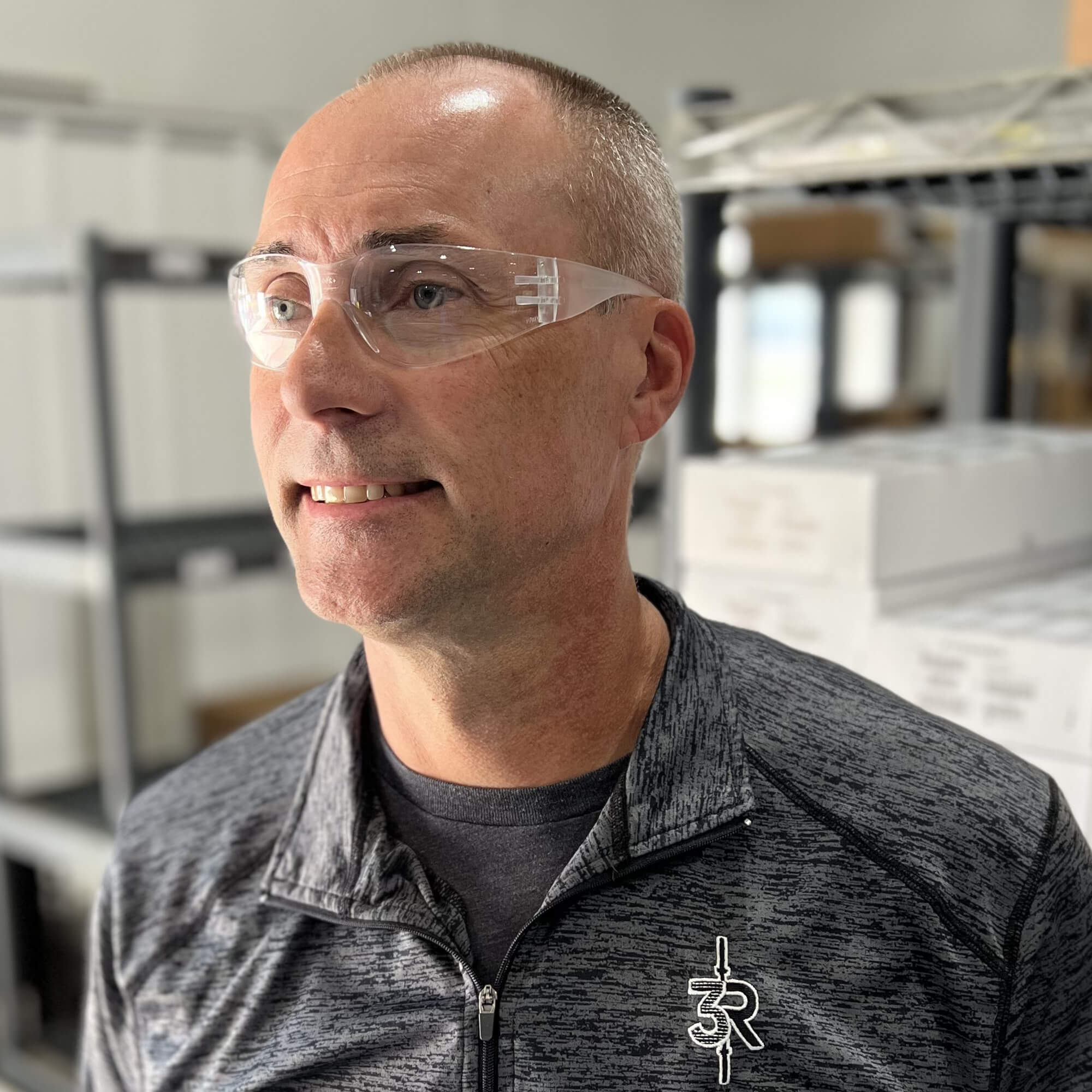 Warehouse worker wearing Pyramex S4110R Intruder Readers Bifocal Safety Glasses with Clear Lenses