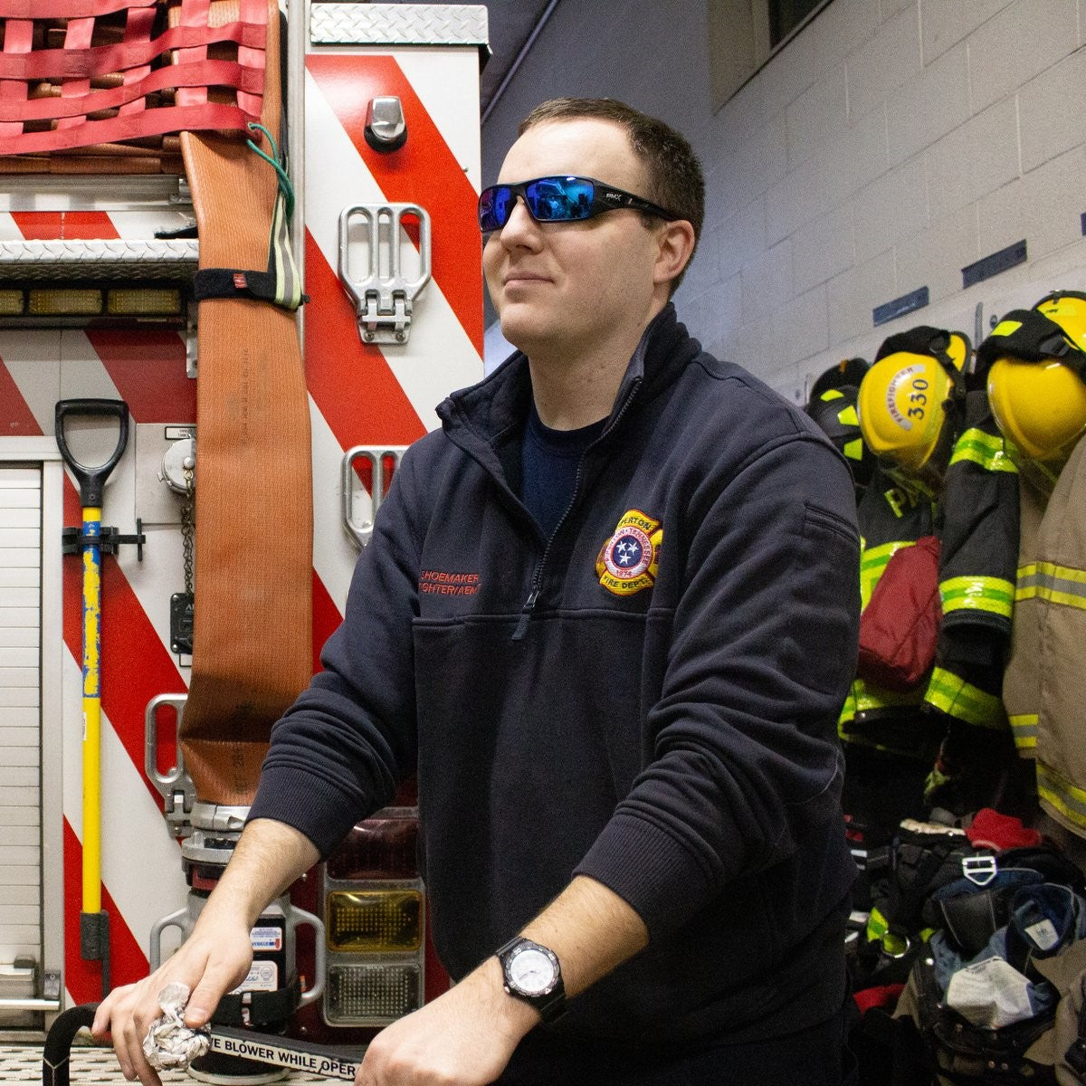 Pyramex SB10465D Velar Safety Glasses - Black Frame - Ice Blue Mirror Lens worn by fire fighter