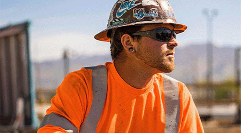 Construction worker wearing Edge Brazeau Safety Glasses Matte Black with Polarized Smoke Lens