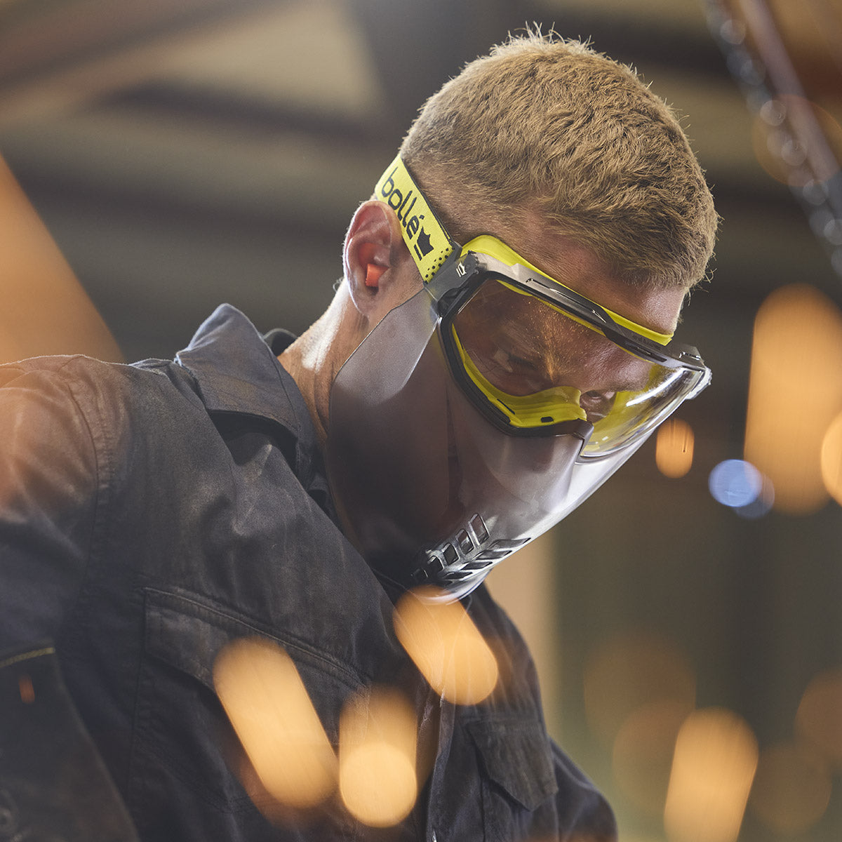 Bolle Universal Goggle Faceguard UNIVGN12W mounted to Universal Goggle worn on job