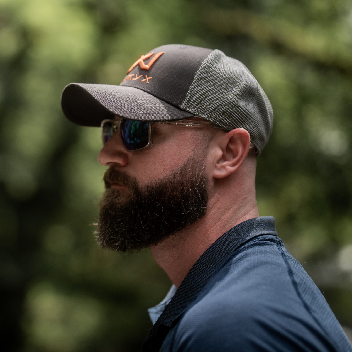 Man wearing Wiley X Alfa Safety Glasses with a Wiley X Hat