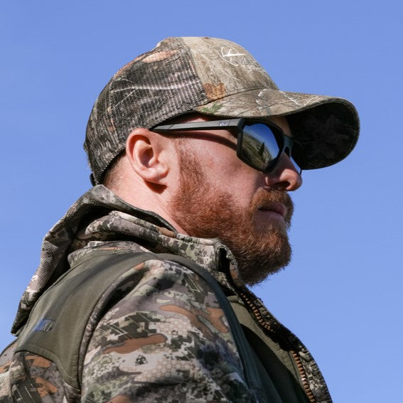 Wiley X Sierra Safety Sunglasses worn by hunter with camo clothing