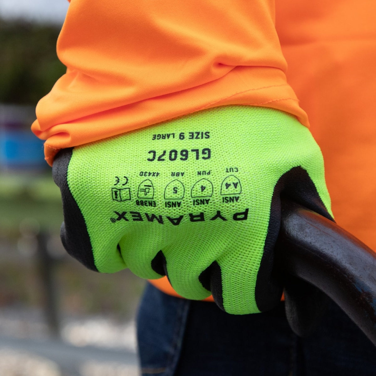 Worker wearing Pyramex GL607C Hi-Vis Cut-Resistant A4 Foam Nitrile Dipped Gloves