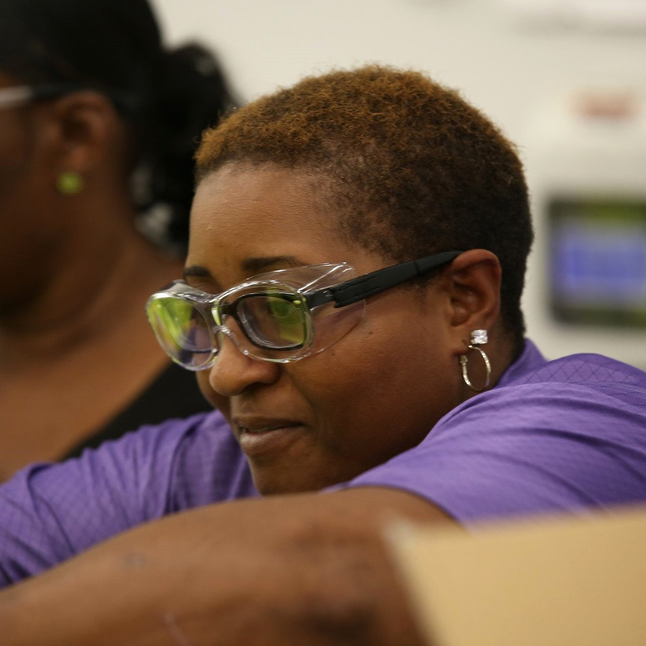 Worker wearing Pyramex S7510SJ OTS XL Safety Glasses - Black Temples - Clear Lens