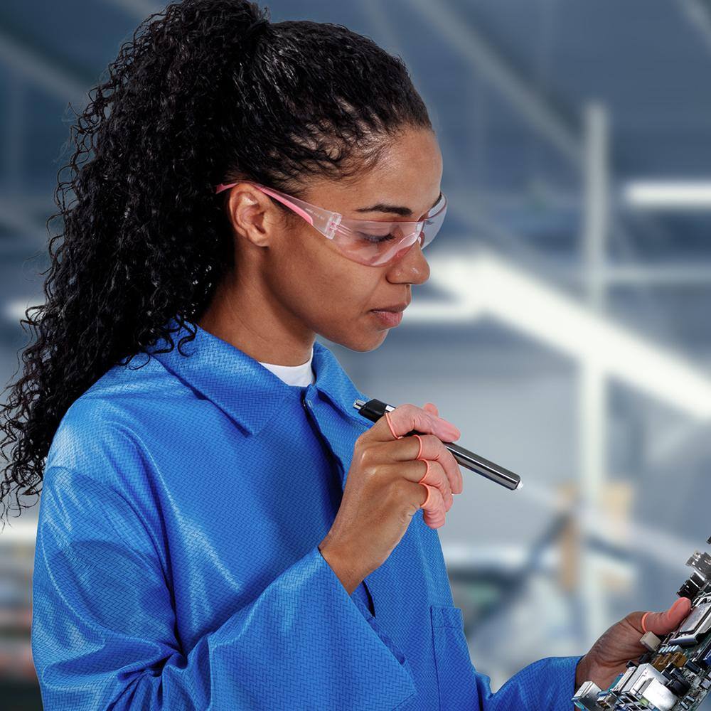 Bouton Eva Women's Safety Glasses with Pink Frame and Pink Lenses worn by worker performing a product inspection