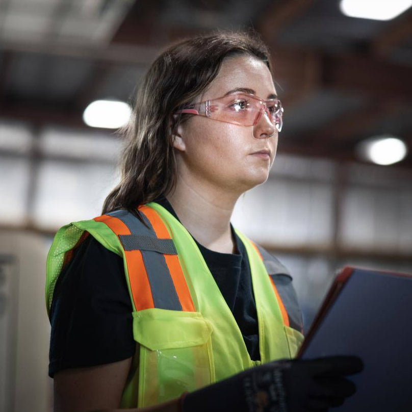 Bouton Eva Women's Safety Glasses with Pink Frame and Pink Lenses worn by warehouse worker