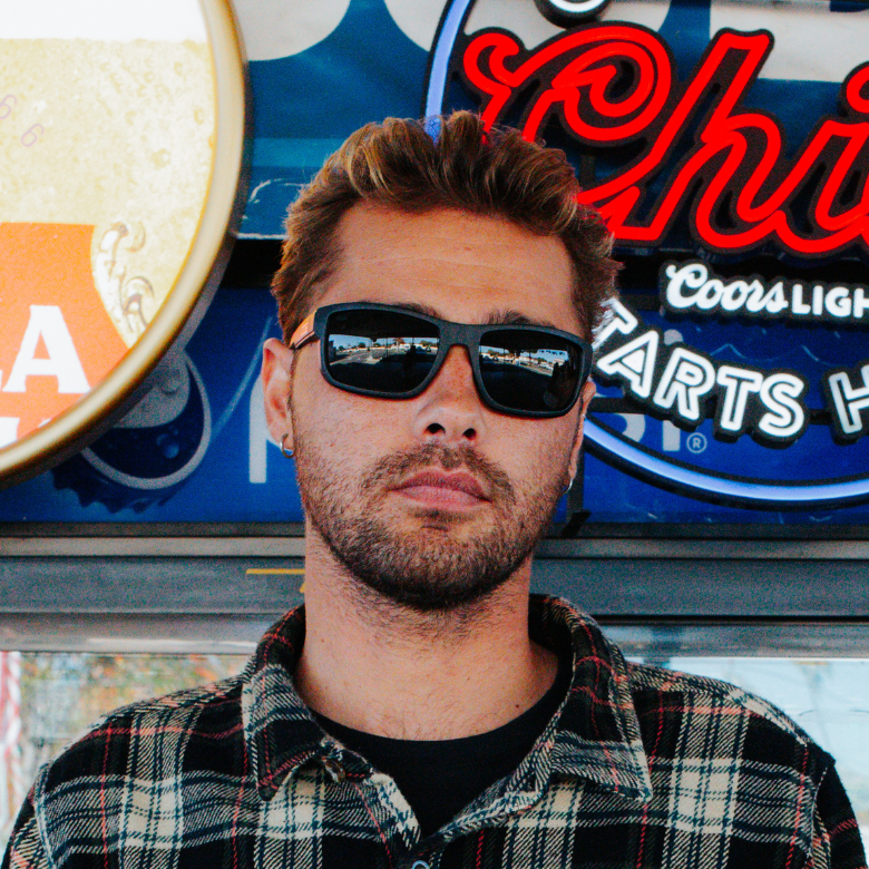 CO Eyewear Magneto Z87+ safety glasses with matte black frame, worn by a man.