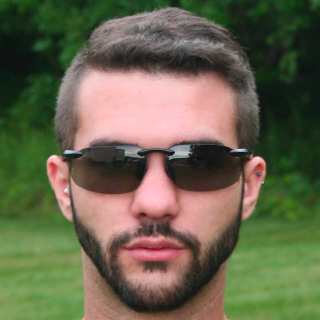 Bullhead Swordfish Safety Glasses with Matte Black Frame and Polarized/Photochromic Smoke Lens - Activated