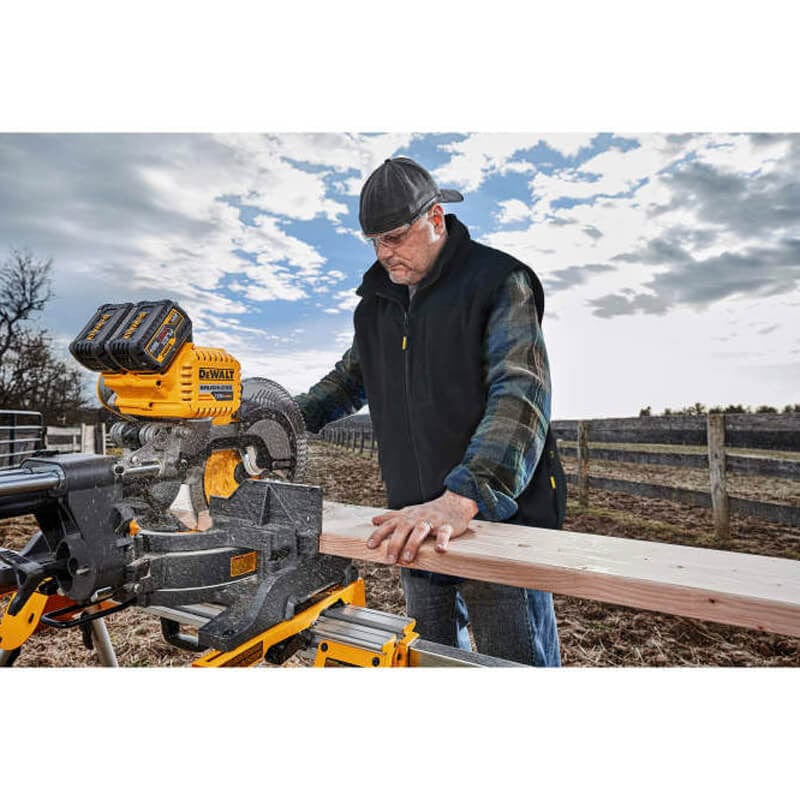 DEWALT Unisex Heated Reversible Fleece Heated Vest With Battery & Charger - Man Working Wearing Vest