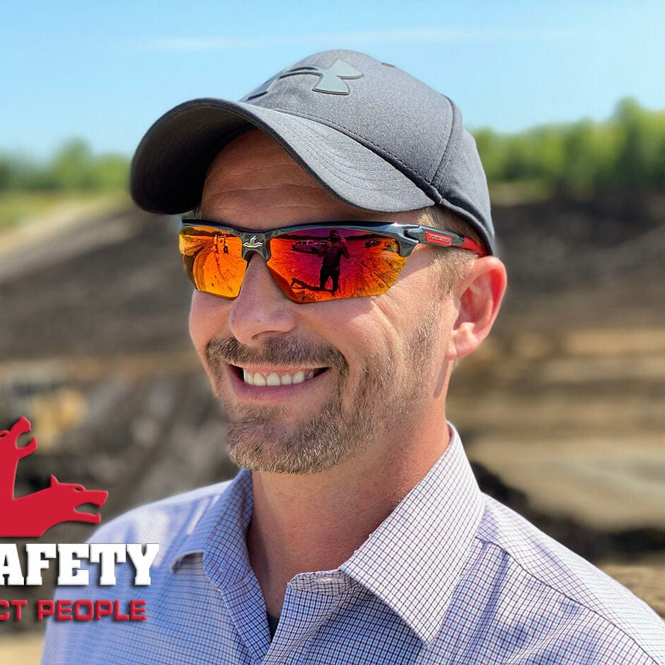 MCR Safety DM131R Dominator DM3 Safety Glasses Gray Red Frame Red Mirror Lenses worn by a worker wearing a hat