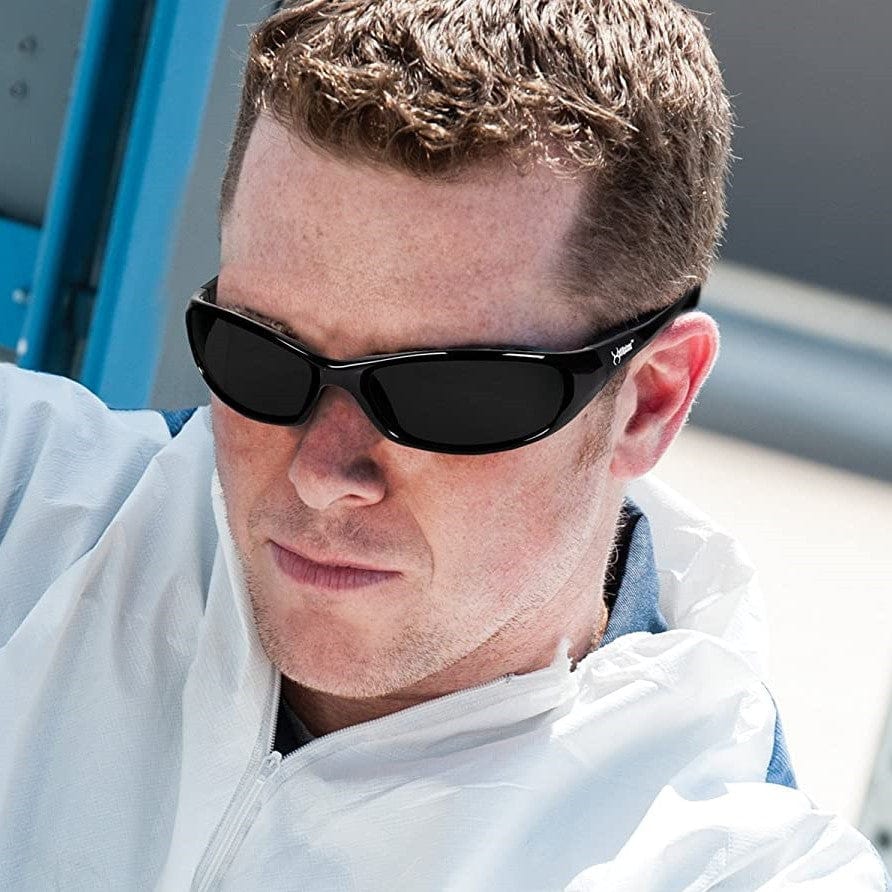 Worker wearing KleenGuard 25714 Hellraiser Safety Glasses with Smoke Lens