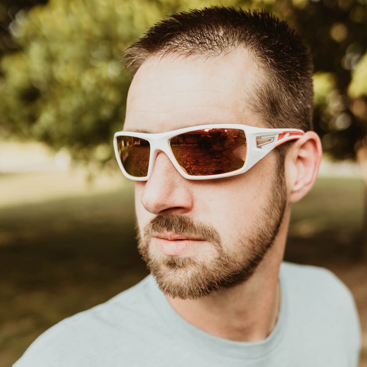 Metel M30 Safety Glasses with White Frame and Orange Mirror Lenses Lifestyle