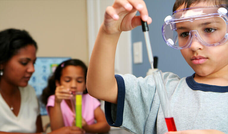 Child performing a lab experiment