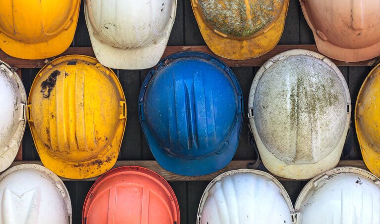 A collection of used hard hats