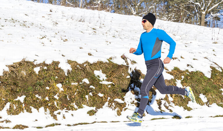 Jogger running in the snow