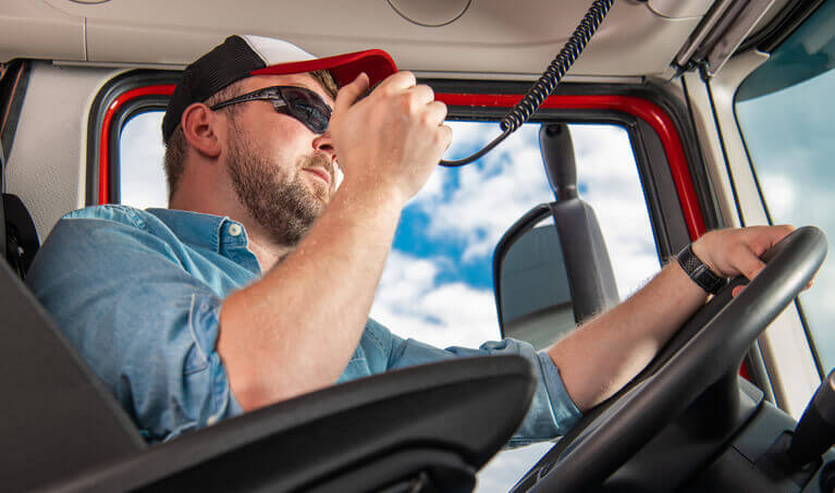 Truck driver using his two-way radio