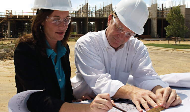 Workers wearing bifocal safety glasses