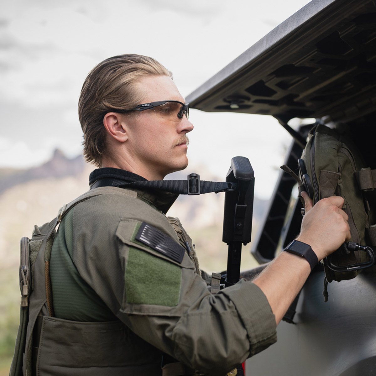 Bolle BSSI Tryon PSSTRYOC13B Ballistic Safety Glasses Black Frame with CSP Platinum Anti-Fog Lenses preparing for a mission