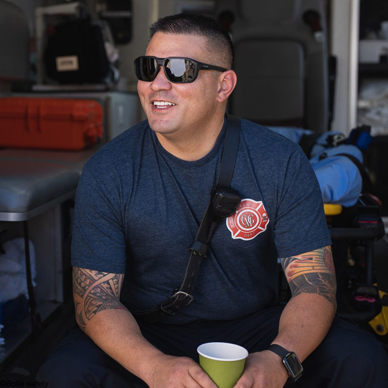 Bolle KNOXXT20M Knox Safety Glasses Black with Smoke Lenses, worn by a firefighter