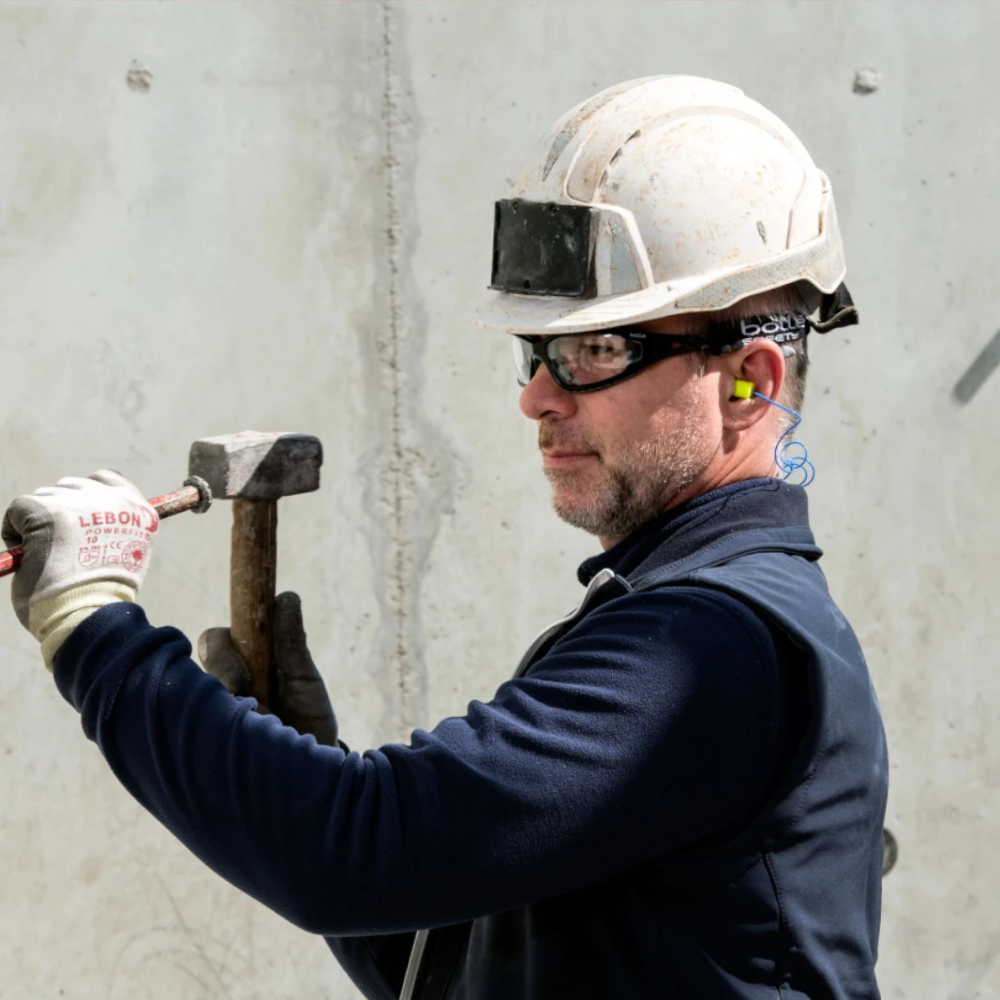 Construction worker wearing Bolle Tracker Safety Glasses with Clear Lenses and a white hard hat