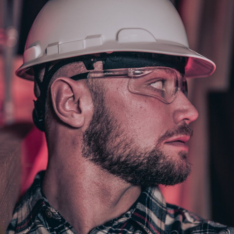 MCR Safety BK3 Safety Glasses with Clear Lenses worn by a construction worker wearing a white hard hat