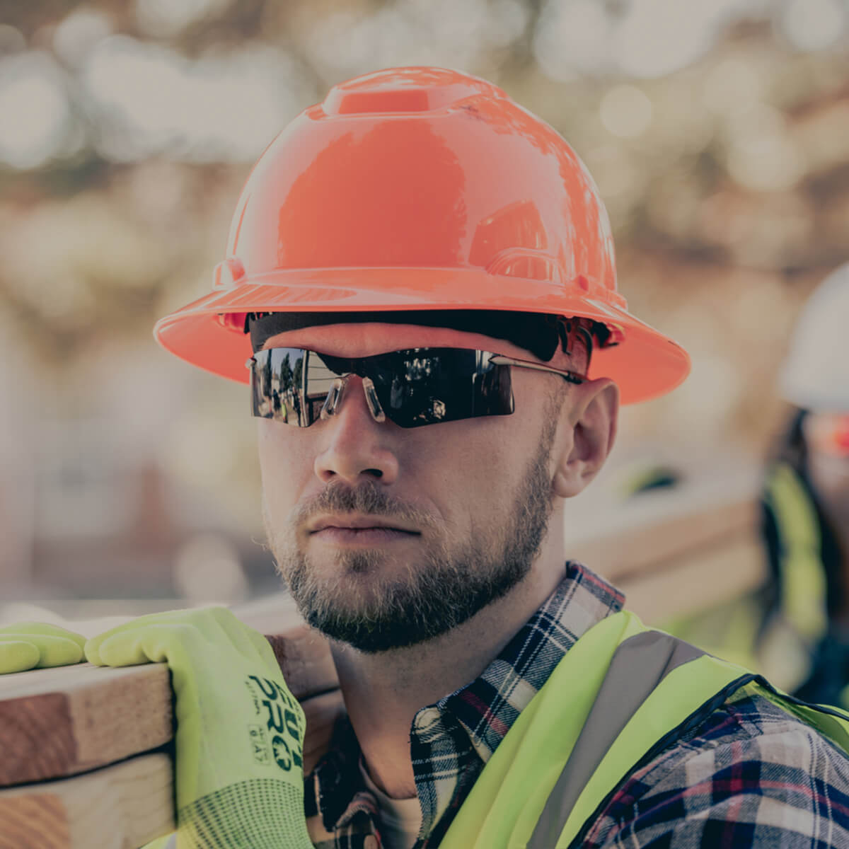 MCR Safety T4112AF Rubicon T4 Safety Glasses with Gray Anti-Fog Lens worn by construction worker