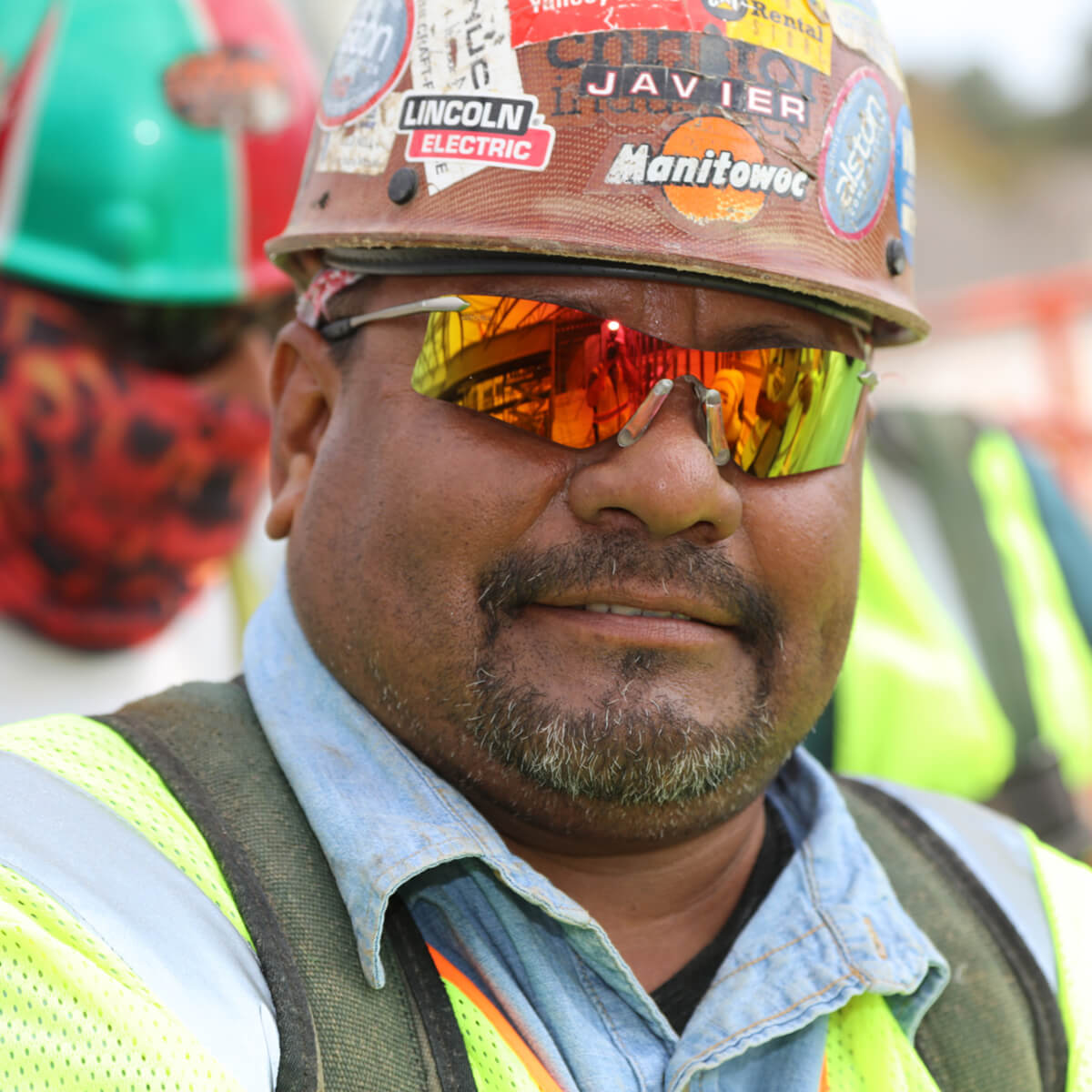 MCR Safety T411R Rubicon T4 Safety Glasses with Fire Mirror Lens worn by worker