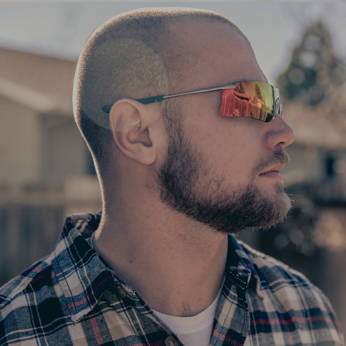 MCR Safety T411R Rubicon T4 Safety Glasses with Fire Mirror Lens worn by worker outdoors