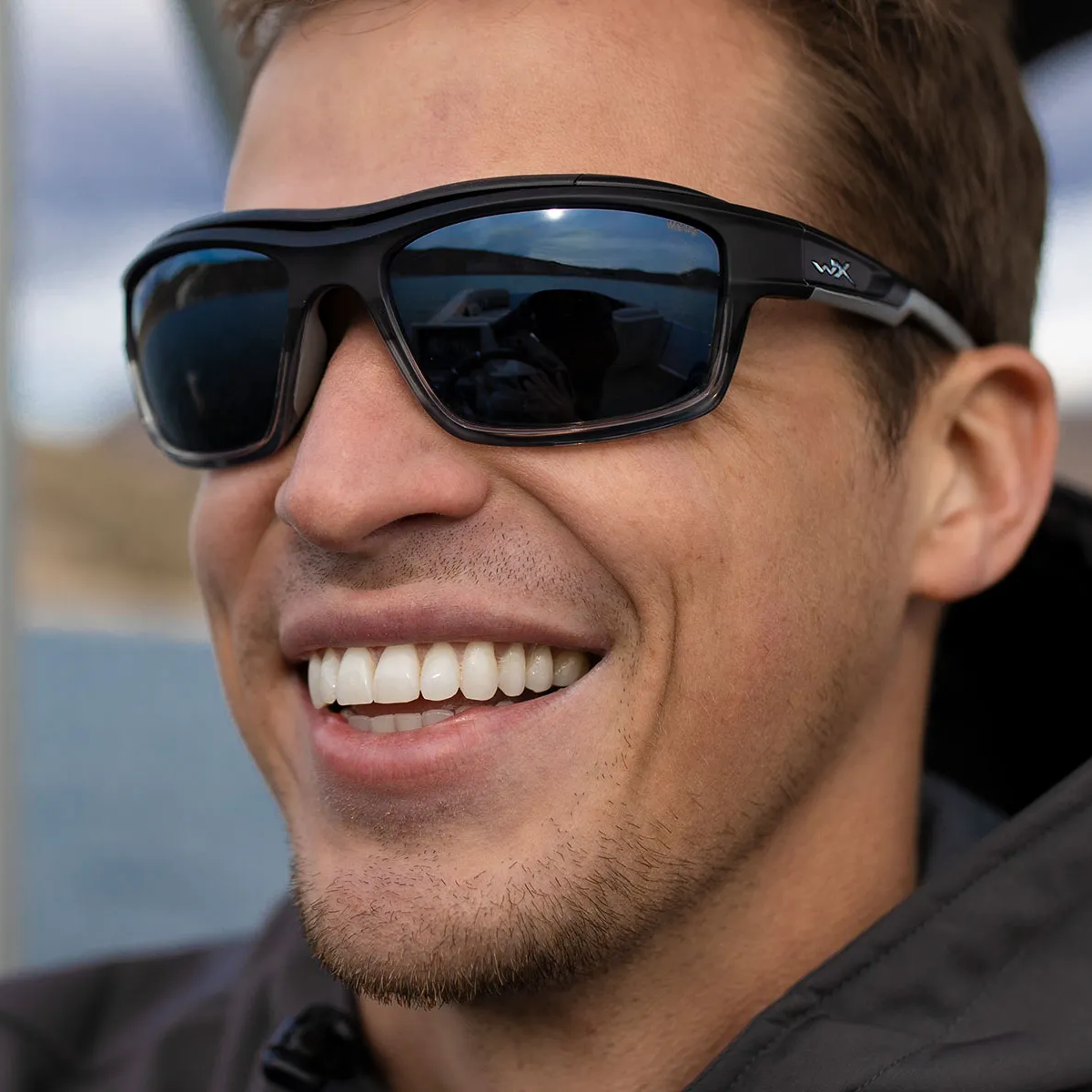 Man wearing Wiley X Ozone Sunglasses with Blue Mirror Lenses